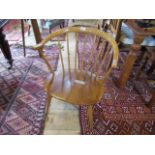 An Ercol hoop-backed child's armchair.