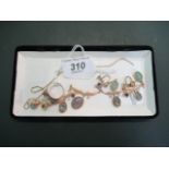 An opal and garnet fringe necklace, having engraved leaf work front piece,