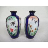 A pair of brass and enamel Japanese vases, circa 1900,