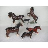 A collection of six ceramic horses, to include examples by Beswick and Royal Doulton.