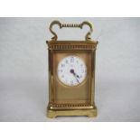 An early 20th century French gilt brass carriage clock,