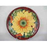 A contemporary Moorcroft plate, designed by Rachel Bishop, in the Inca Sunflower pattern,