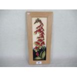 A contemporary Moorcroft framed plaque, designed by Kerry Goodwin, in the Foxglove pattern,