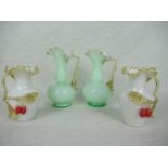 A pair of Victorian green vaseline glass jugs, having frilled collars on a circular foot, 18cm,