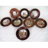 A collection of eight wooden framed Pratt Ware pot lids, to include examples titled: The Times,