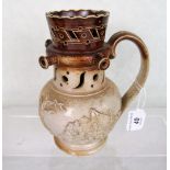 A Victorian salt glazed stoneware puzzle jug, typically decorated with relief sprigs, 17.5cm.