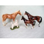 Three ceramic horse figurines, together with a Sherratt & Simpson study of a poodle.