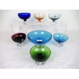 A mid-20th century Swedish glass fruit set, comprising: a blue glass fruit bowl on moulded base,