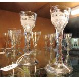 A pair of 18th century-style cordial glasses, each with Oriental landscape etched bowl,