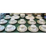 An early 20th century Aynsley tea service, comprising: twelve cups, saucers and side plates,