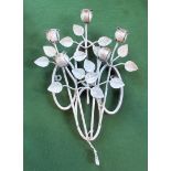 A silver painted wrought iron wall mounting garden decoration, fashioned as miniature roses.