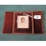 A rectangular gilt framed portrait miniature of a young boy,