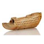 Ø AN UNUSUAL AND RARE MARINE IVORY MODEL OF A MAN-O-WAR, POSSIBLY SAILORWORK, THIRD QUARTER 17THC