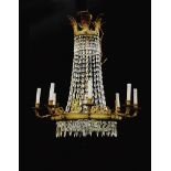 Empire gilt-bronze and crystal eight-light chandelier 19th century, pierced leaf crown, figures, and