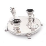 Continental silver figural ink stand 19th century, footed plateau fitted with ewer-top