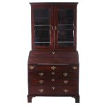 George III mahogany bureau bookcase circa 1780, molded cornice, glazed doors with shaped frames,