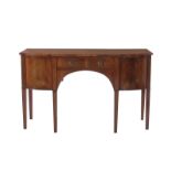 George III style bowfront sideboard circa 1900, shaped top, drawer flanked by doors, tapered legs;