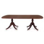 Sheraton style inlaid mahogany dining table crossbanded top, turned pedestals, fluted saber legs and