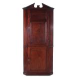 English mahogany double corner cabinet first half 19th century, broken canted pediment, conforming