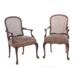 Pair George III style carved mahogany library armchairs late 19th century, cane backrest,