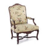 Louis XV carved walnut armchair 18th century, carved frame, serpentine seat, X-brace stretcher,