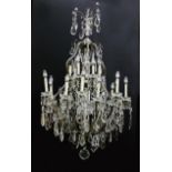 Continental bronze and crystal chandelier early 20th century, scrolling frame, crystal baluster