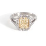 Platinum and fancy intense yellow diamond ring