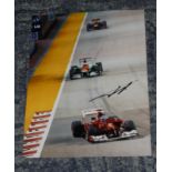 Fernando Alonso signed photo. Colour 8x10 Formula One action photo signed by driver and former World