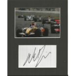 Nelson Piquet Jnr signature piece mounted below colour photo. Good condition.