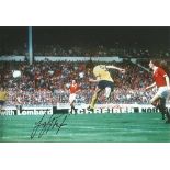 Frank Stapleton 1979 Colour 12 X 8 Photo Depicting Arsenal's Frank Stapleton Scoring With A Bullet