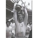 Jack Charlton 1972, B/W 12 x 8 photo depicting Leeds United's Jack Charlton holding aloft the FA Cup