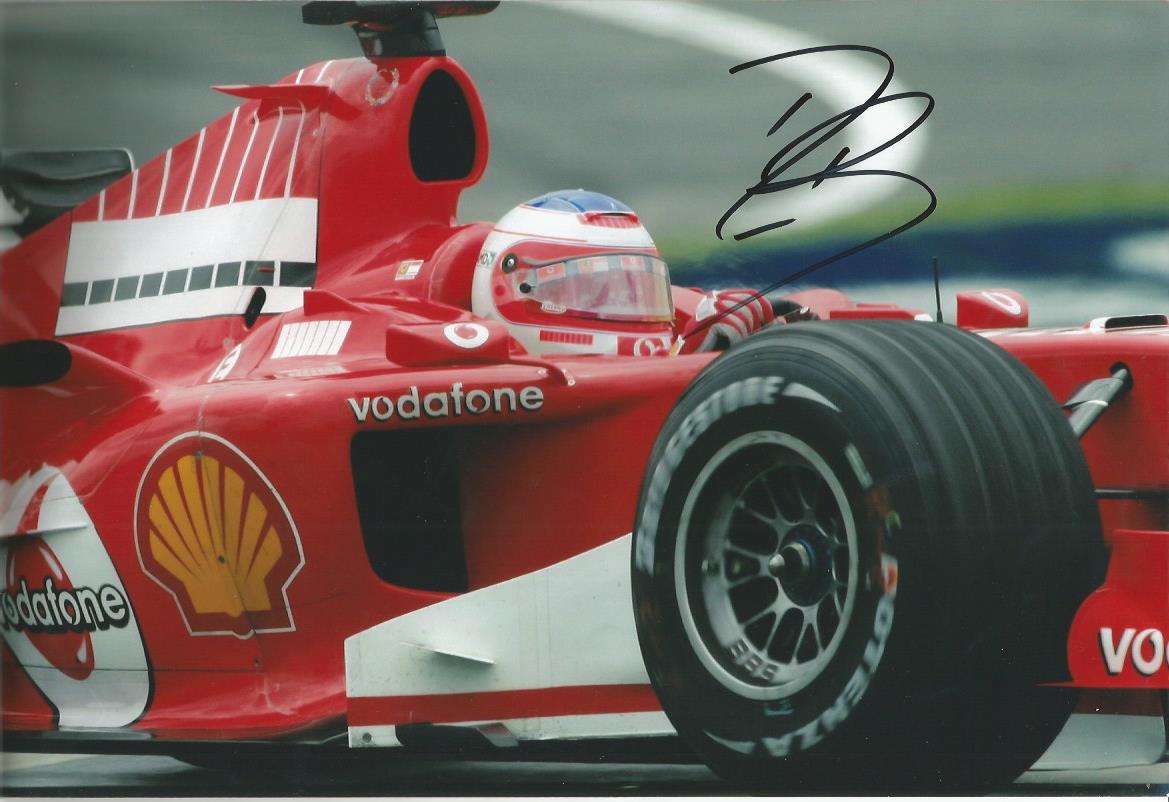 Rubens Barrichello signed 12 x 8 colour Ferrari action photo. Formula One Motor Racing Driver. He