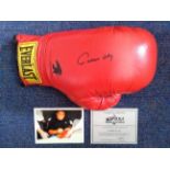 Cassius Clay Muhammad Ali signed 16oz Everlast boxing glove, with colour photo of the signing.