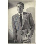 Peter Lawford signed 6 x 4 postcard photo, 1 inch tear to bottom and some tape marks to back. Good