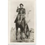 Max Miller signed small postcard size b/w photo. Amusing photo sitting on rear of a horse. Good