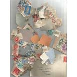 Assorted Countries used and mint stamps in mailing envelopes in carrier bag. Approx. 400+ unsorted