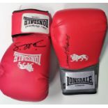Boxing Gloves. Two full size Red Lonsdale gloves signed by Danny Williams and Dennis Andries. Good