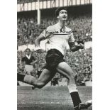 Maurice Norman signed 12x8 b/w football photo. In Spurs kit. Good Condition. All signed items come