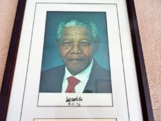 Nelson Mandela autograph, 20cm x 30cm colour photo clearly signed by him in black marker. Mounted to