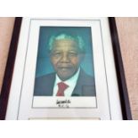 Nelson Mandela autograph, 20cm x 30cm colour photo clearly signed by him in black marker. Mounted to