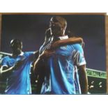 Vincent Kompany signed 16x12 colour football photo in Man City kit. Good Condition. All signed items