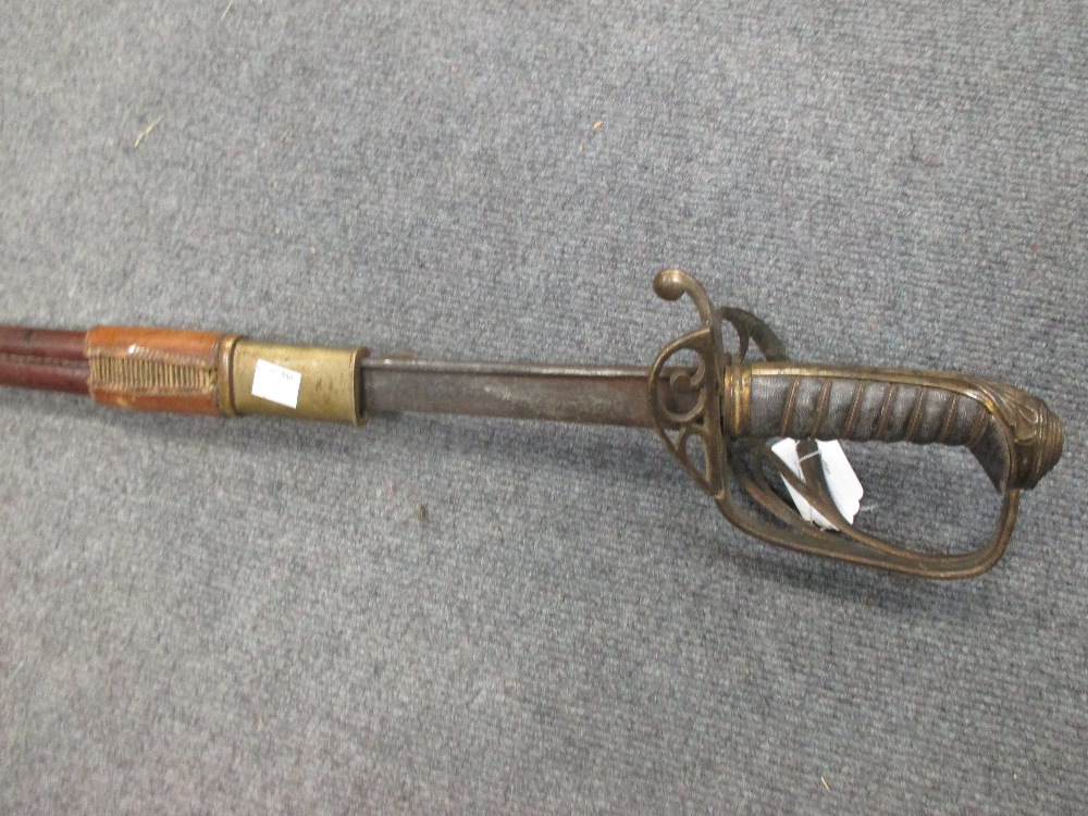 A British 1796 pattern Infantry Officer's Sword, with fold down guard, in associated scabbard