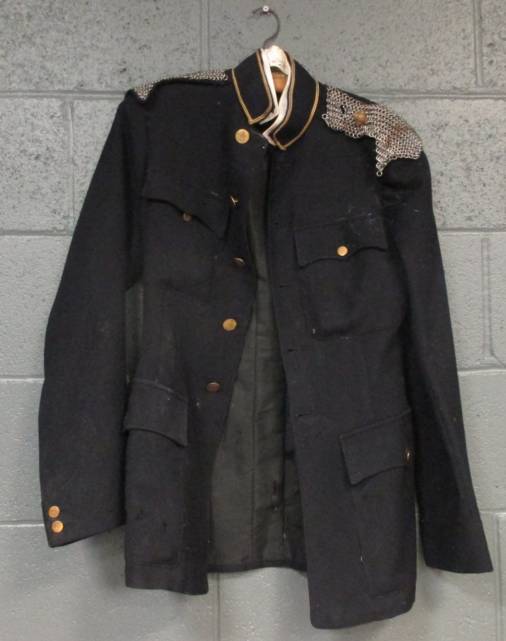 A 19th century Officer's uniform of the West Devon Yeomanry, buttons etched with a crown over cannon
