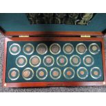 A case of twenty Roman bronze coins, a collection with an example from each Emperor from
