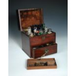 A 19th century mahogany apothecary box with single drawer and fitted interior, containing twenty one