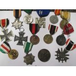 A collection of World War II German medals, to include an SS long service medal, an Eastern People's
