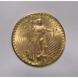 A U.S.A. gold $20 coin, dated 1927, obverse with Liberty holding a torch and olive branch next to