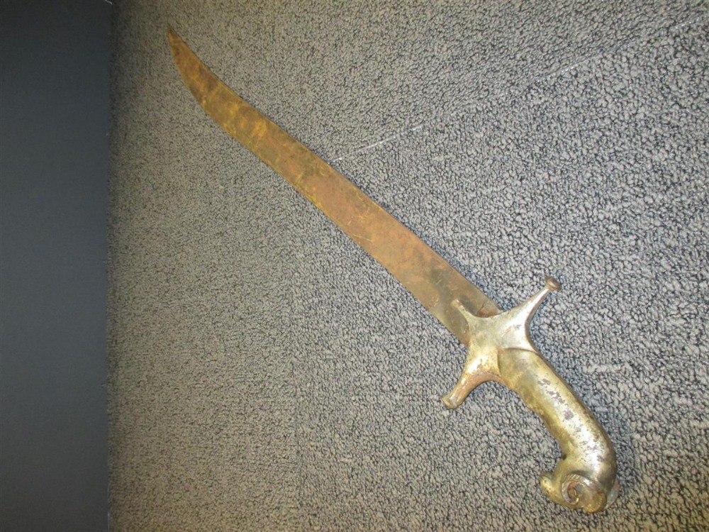 An Indian Tulwar, with heavy curved blade and silvered rams head pommel, together with an Eastern - Bild 2 aus 4