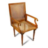 A 19th century mahogany folding campaign chair, with caned back and seat on removable turned legs,