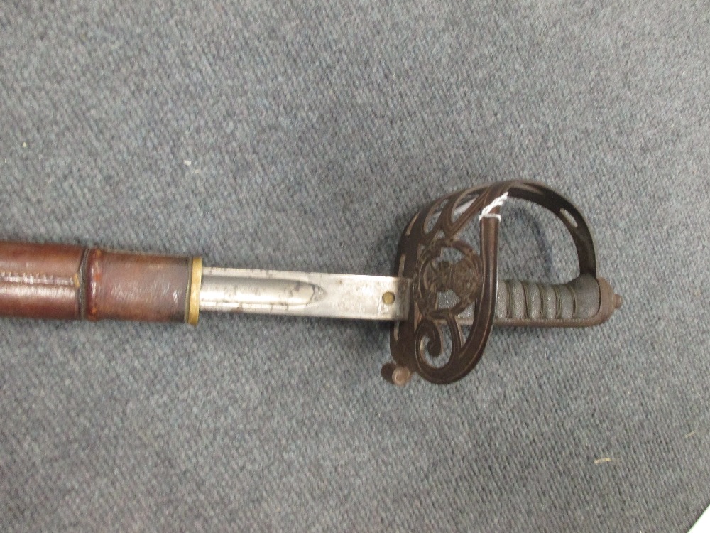 A WWI artillery Officer's sword, with etched blade named G. Berrington-Davies, 108422, together with